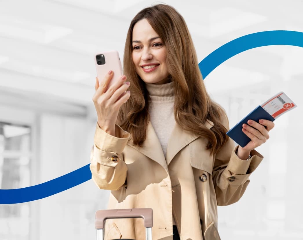 young woman checking phone before flight with travel documents