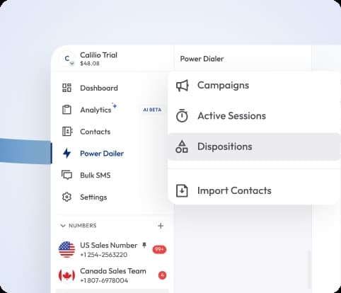 customer support agent talking on a desk phone while working at her computer in an office