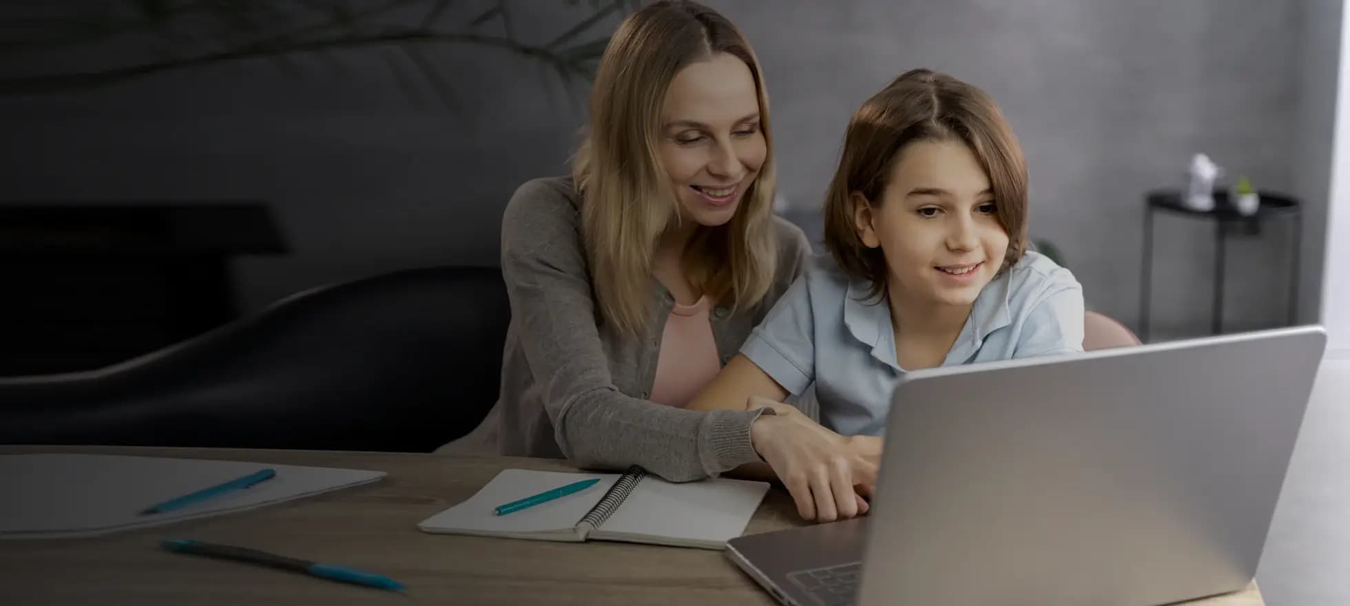 teacher discussing with student through tab